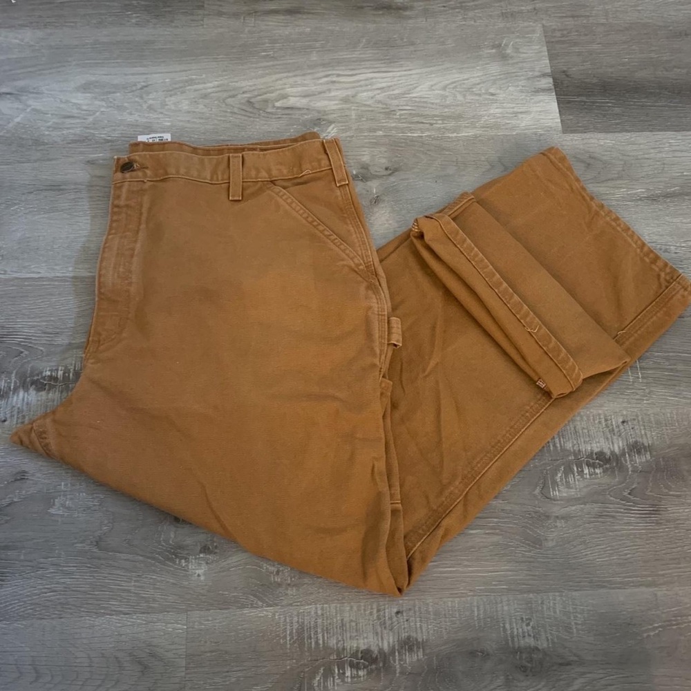 Carhartt company branded dungaree style tan pants